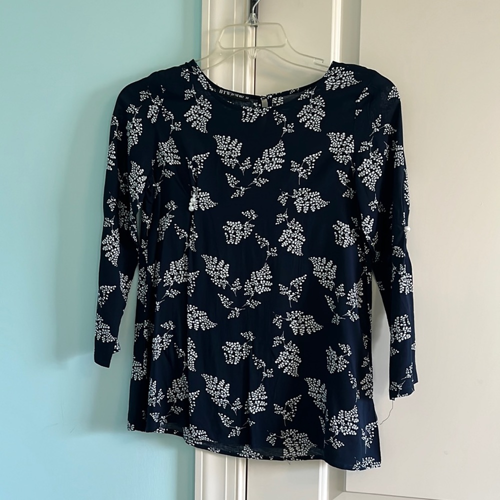 navy blue blouse with white leaves